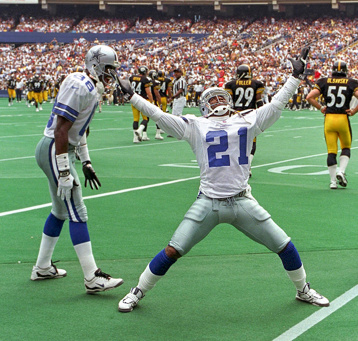 Deion Sanders, playing for the Cowboys, celebrates a play during a game in Pittsburgh.